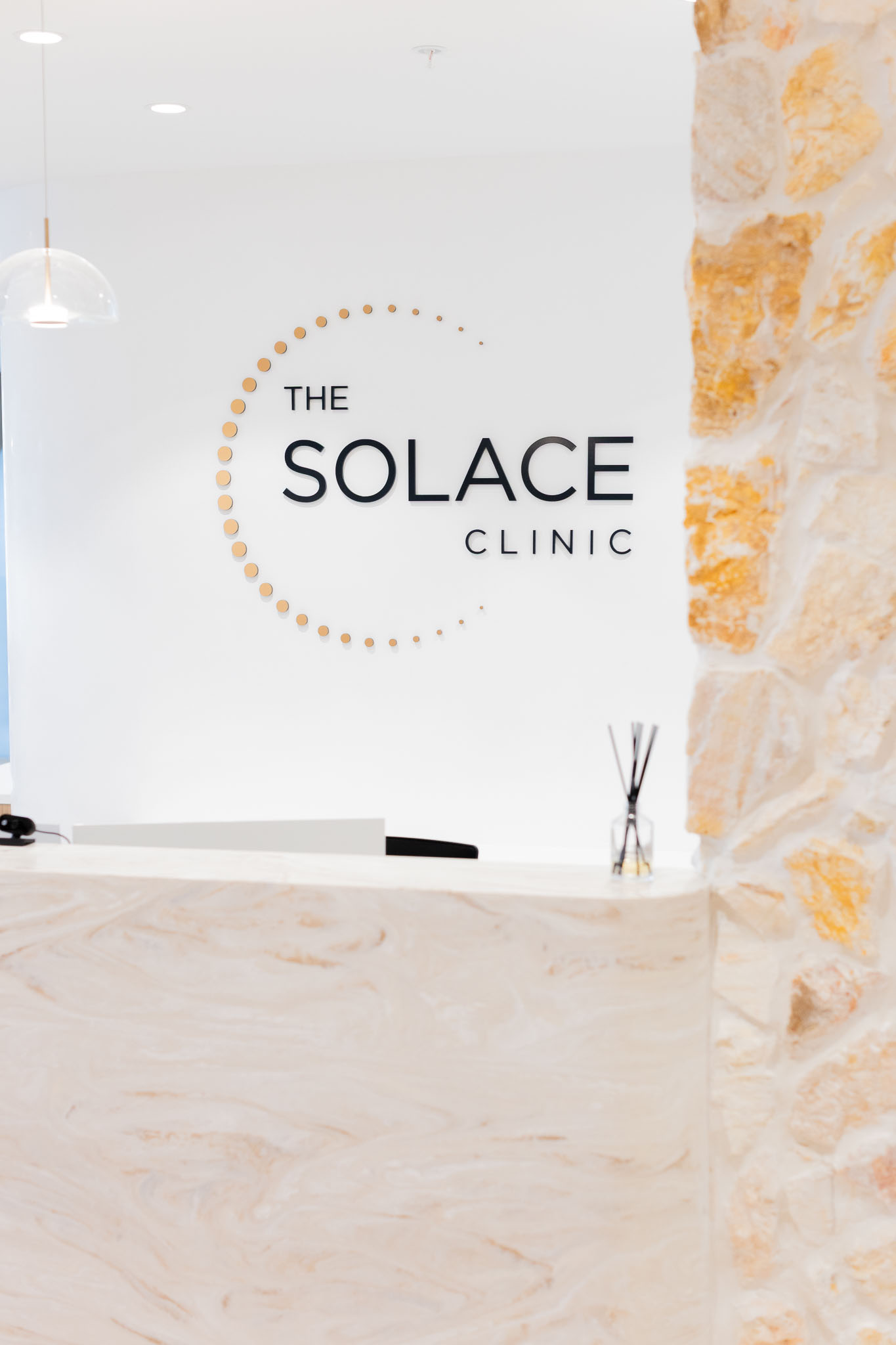 Reception desk and The Solace Clinic logo at the Maroochydore clinic, accompanying patient healthcare rights information.